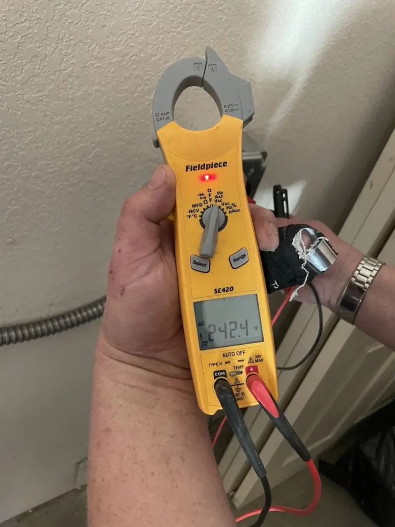 Voltage testing with clamp meter during Electrical Installation Services in Pittsburg